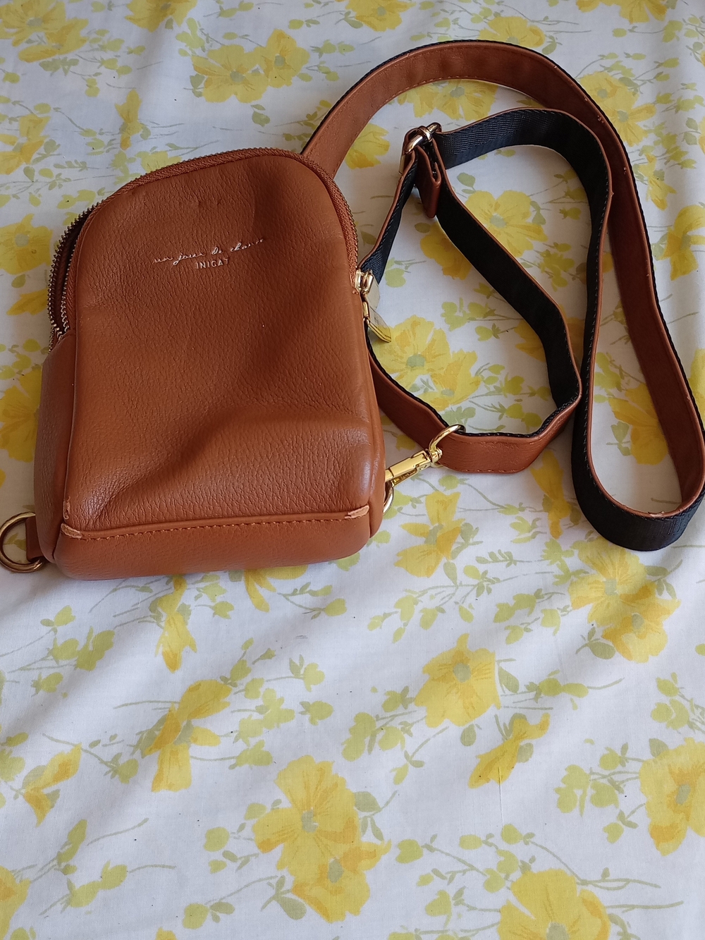 Brown leatherette Inicat sling bag a compact design with dual zipper compartment